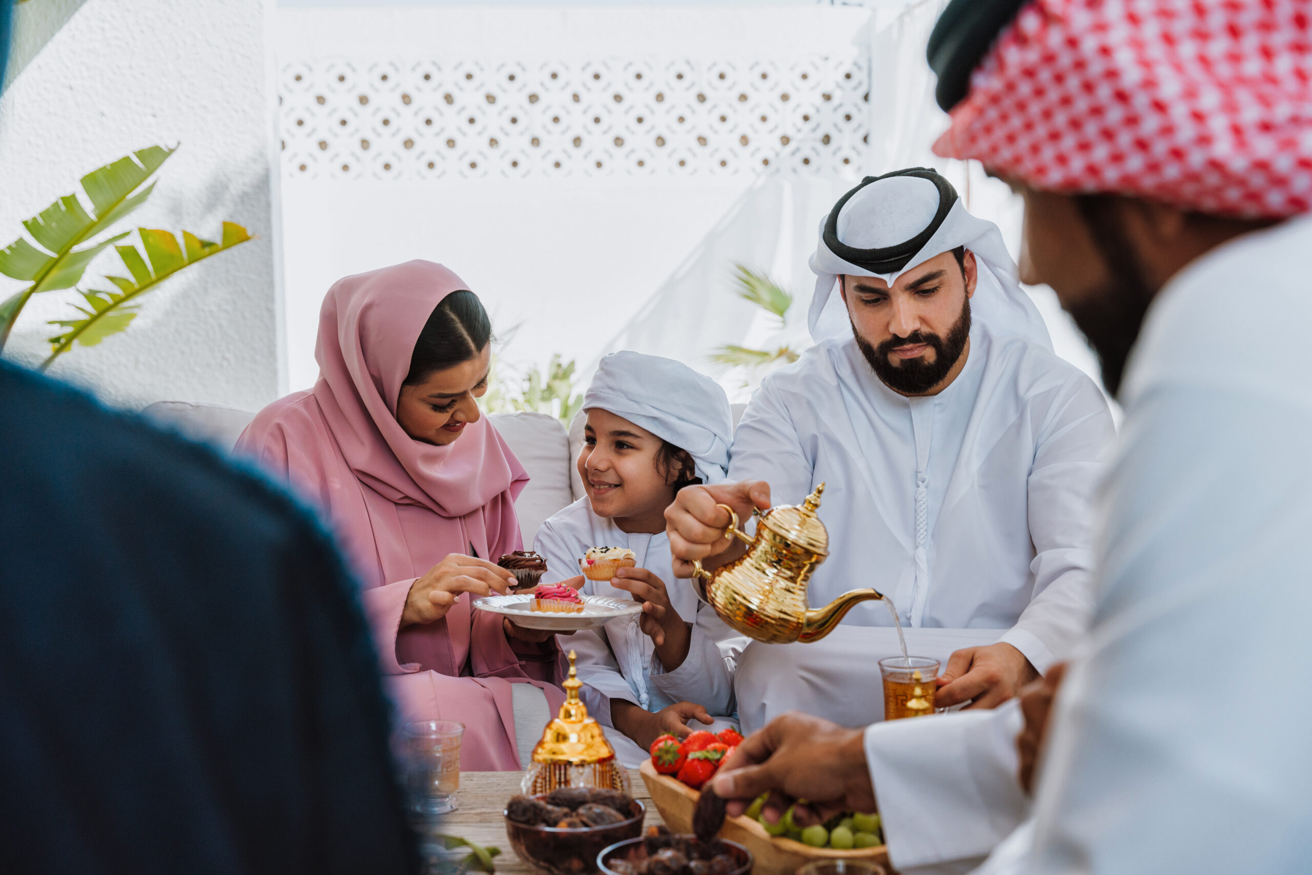 Family gathering with traditional Arabic food during UAE National Day