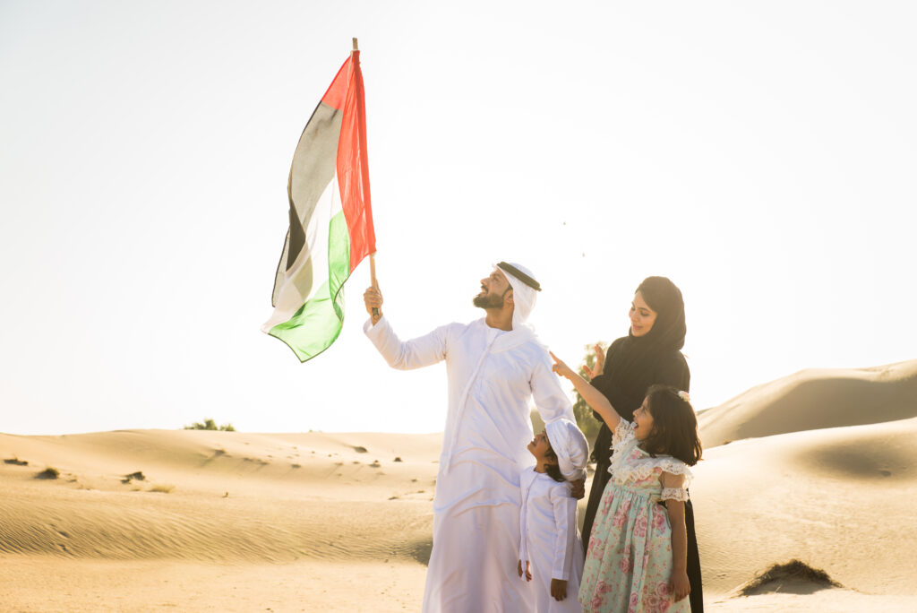 UAE National Day family celebration with Emirati families and UAE flags